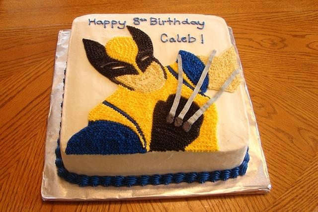 X-men Wolverine birthday cake made as a 2-layer chocolate cake in a 12" square pan.  Wolverine is hand drawn and iced on th